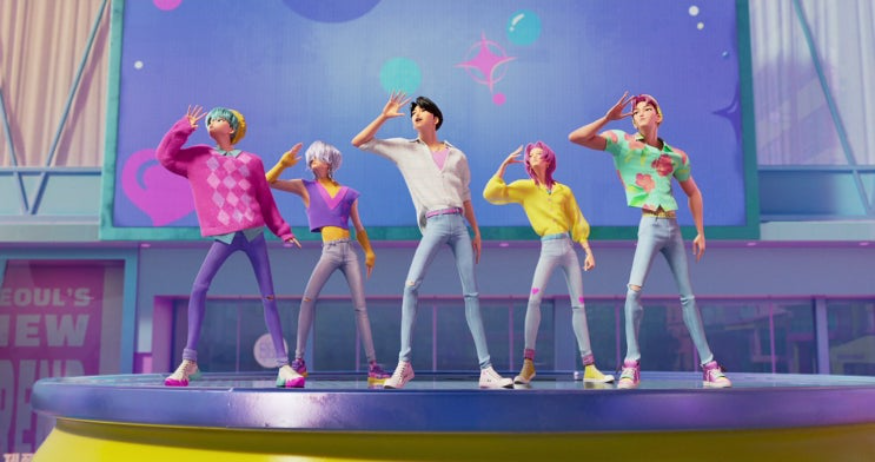 넓은 무대 위에서 다섯 명의 남성 애니메이션 캐릭터들이 춤을 추고 있습니다. 다채로운 의상과 머리색을 하고 있으며, 모두 똑같은 동작으로 팔을 올리고 있습니다. 뒤편에는 'SEOUL'S NEW GROUND'라는 글자가 적힌 간판이 보입니다.