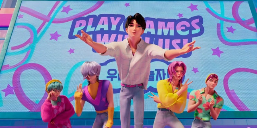 다섯 명의 남성 애니메이션 캐릭터들이 무대 위에 서 있습니다. 가운데에 있는 캐릭터는 양팔을 벌리고 있으며, 다른 네 명의 캐릭터들은 각기 다른 포즈를 취하고 있습니다. 뒤편의 스크린에는 'PLAY GAMES WITH US'라는 글자가 보입니다.